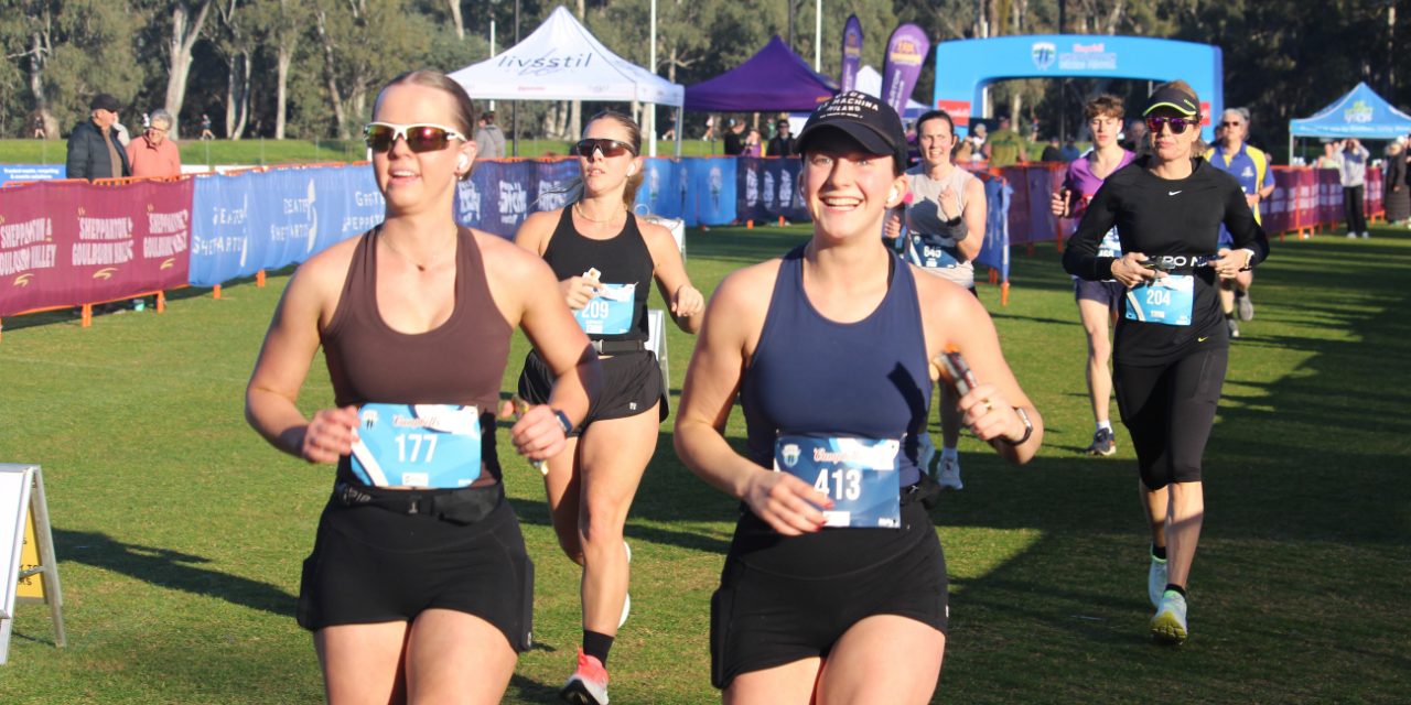 Runners finishing under the Campbell's finish arch at Shepparton